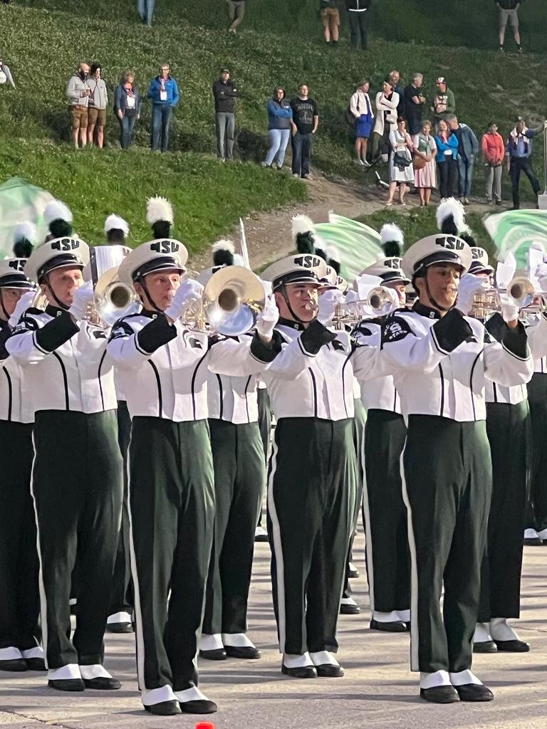 Marching band in uniform during a tour through Europe