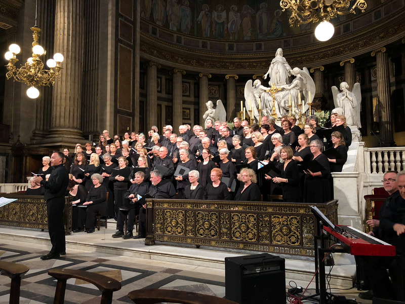 Choir singing in a church during a concert tour