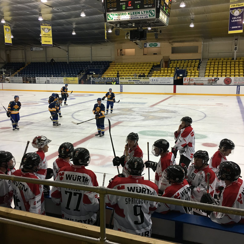 Ice hockey team at the bench during a match in Europe