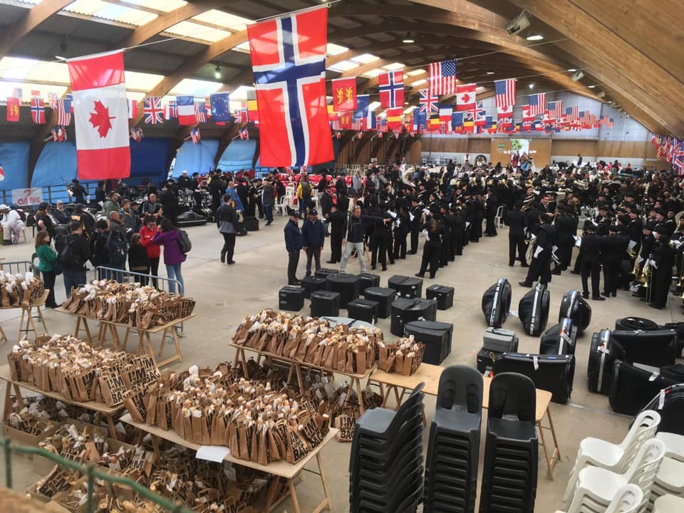 Large ceremony tent with Canadian and Norwegian flags at the D-Day commemoration