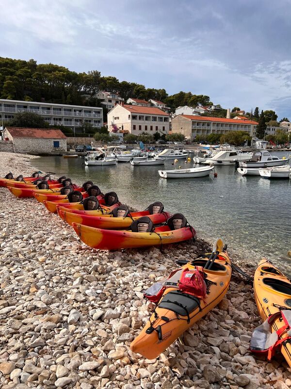 Kayaks on the pebble beach during an incentive trip