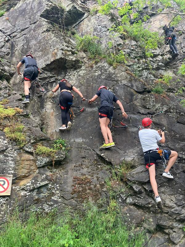 Participants during a climbing and abseiling activity in the mountains